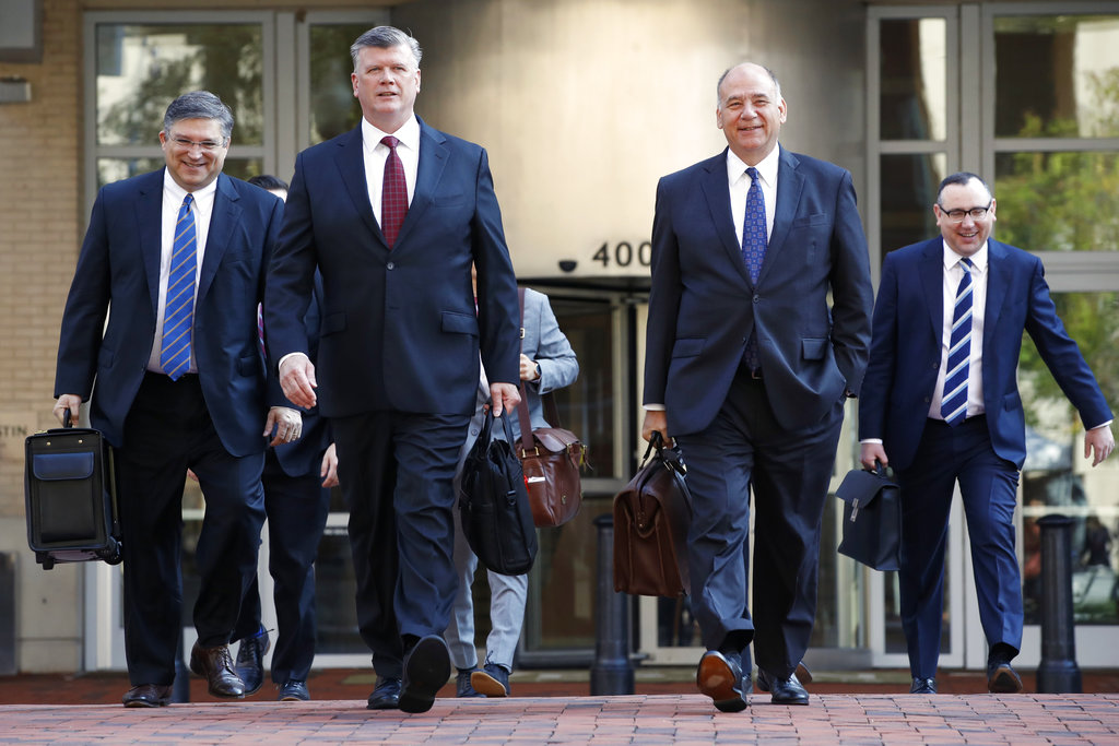 The defense team for Paul Manafort, including Kevin Downing, front left, and Thomas Zehnle, front right, arrive at federal court for the continuation of the trial of the former Trump campaign chairman, in Alexandria, Va., Wednesday, Aug. 8, 2018.