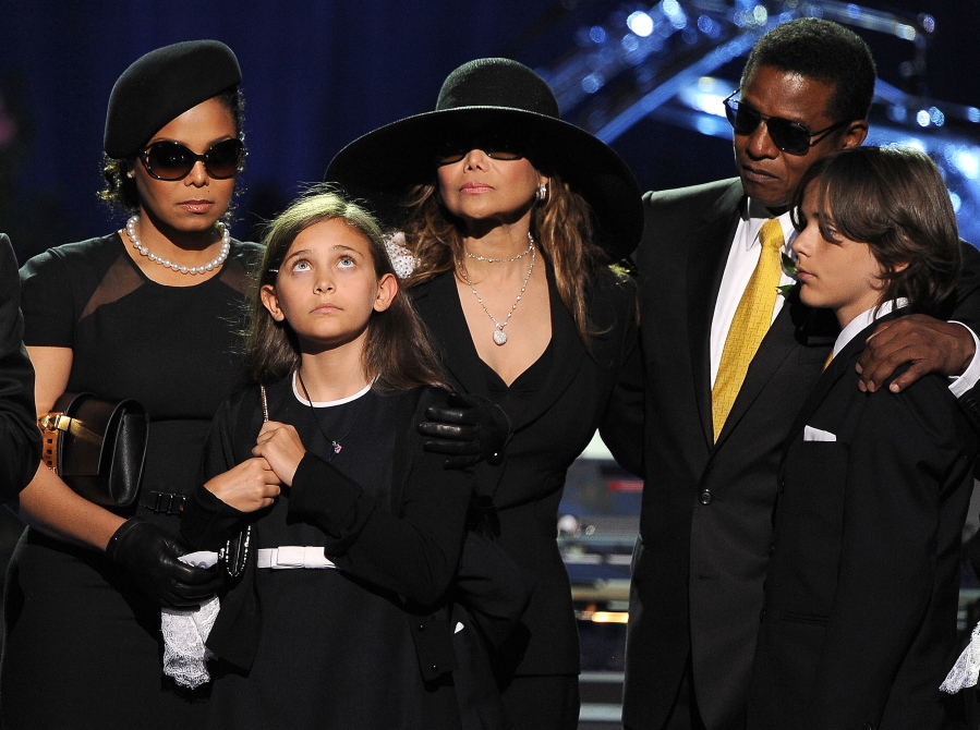 The Jackson family, from left, Janet Jackson, Paris Jackson, LaToya Jackson, Jackie Jackson and Prince Michael appear on stage July 7, 2009, at the memorial service for music legend Michael Jackson, at the Staples Center in Los Angeles. Michael Jackson died on June 25, 2009.