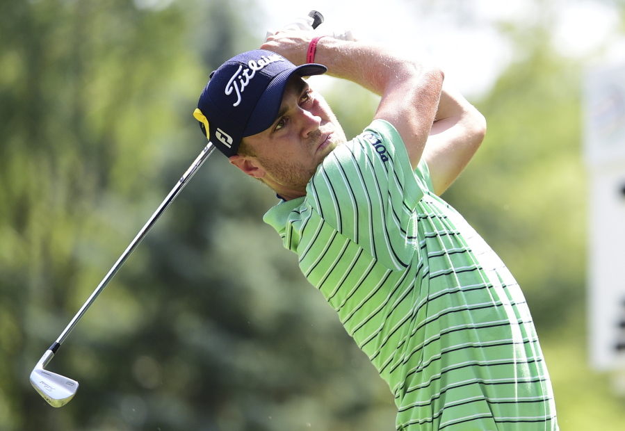 Justin Thomas watches his tee shot on the seventh hole during the final round of the Bridgestone Invitational golf tournament at Firestone Country Club, Sunday, Aug. 5, 2018, in Akron, Ohio.