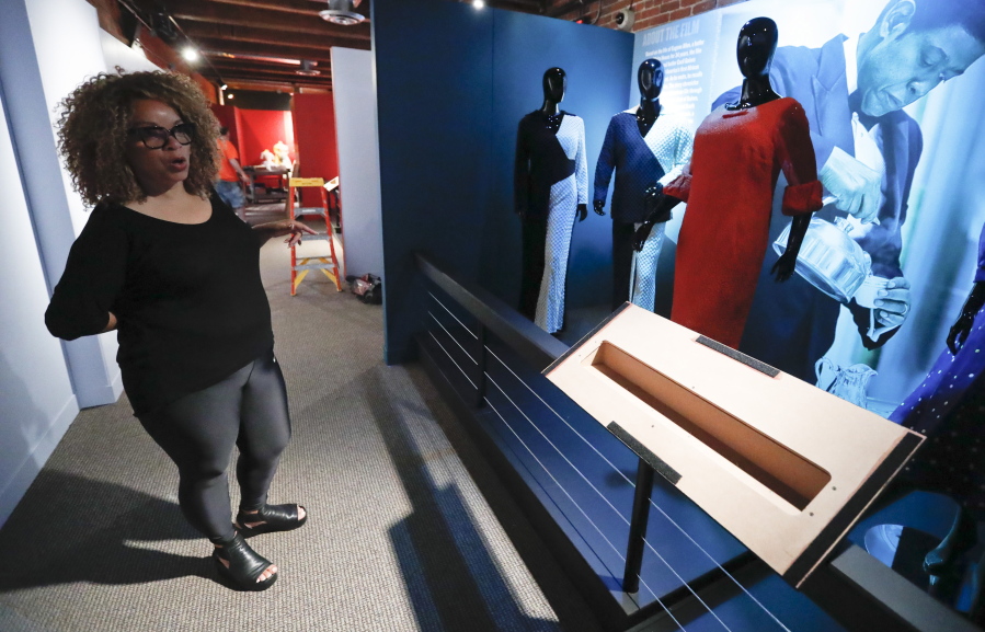 In this photo made on Thursday, Aug. 23, 2018, Ruth E. Carter gives direction as installers work on preparing the costumes from the movie “The Butler” at an exhibit of her cinematic costumes at Pittsburgh’s Senator John Heinz History Center in Pittsburgh. The exhibit that opens Saturday, Aug. 25, explores Carter’s groundbreaking career. “Heroes & Sheroes: The Art and Influence of Ruth E. Carter in Black Cinema” showcases over 40 costumes from nine movies. The costumes include those from “Amistad,” “What’s Love Got to do With It,” “The Butler,” “Malcolm X,” “Selma,” “Do the Right Thing” and of course “Black Panther.” It is scheduled to run to Dec. 2, 2018.