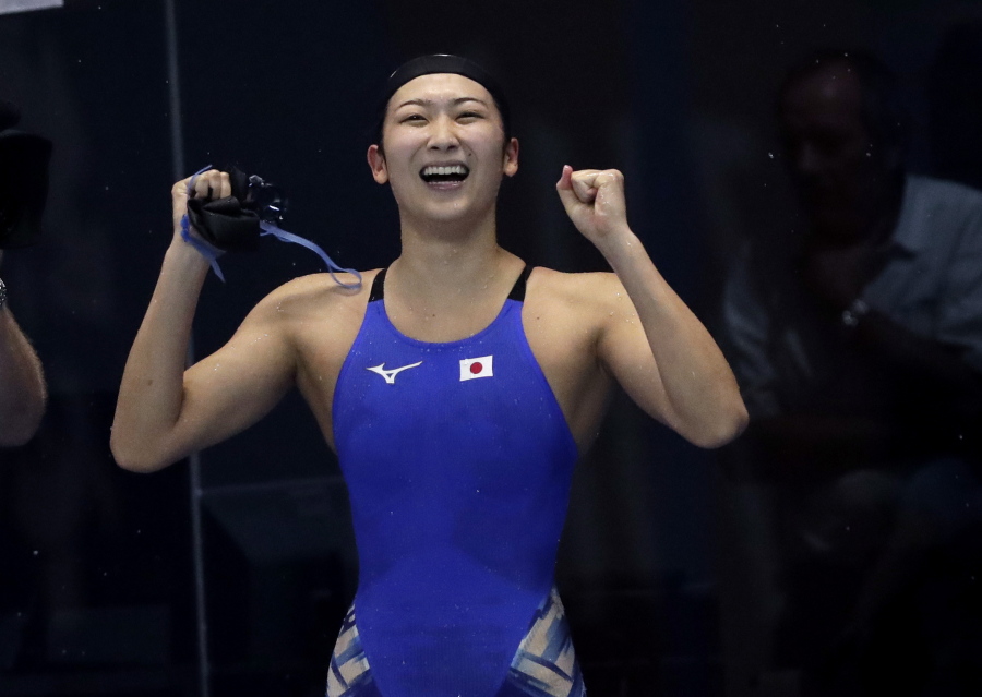Japan’s Rikako Ikee celebrates after winning the women’s 50m freestyle final during swimming competition at the 18th Asian Games in Jakarta, Indonesia, Friday.