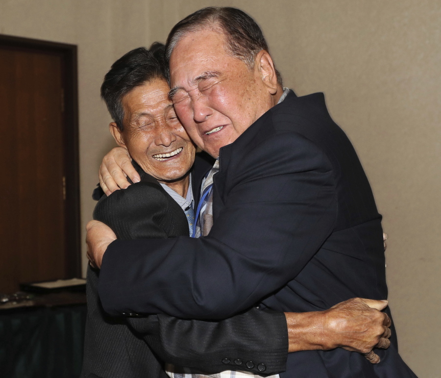 FILE - In this Aug. 20, 2018, file photo, South Korean Ham Sung-chan, 93, right, hugs his North Korean brother Ham Dong Chan, 79, during the Separated Family Reunion Meeting at the Diamond Mountain resort in North Korea. After nearly 70 years of a separation forced by a devastating 1950-53 war that killed and injured millions and cemented the division of the Korean Peninsula into North and South, Ham and his North Korean brother only got a total of 12 hours together. (Lee Ji-eun/Yonhap via AP.