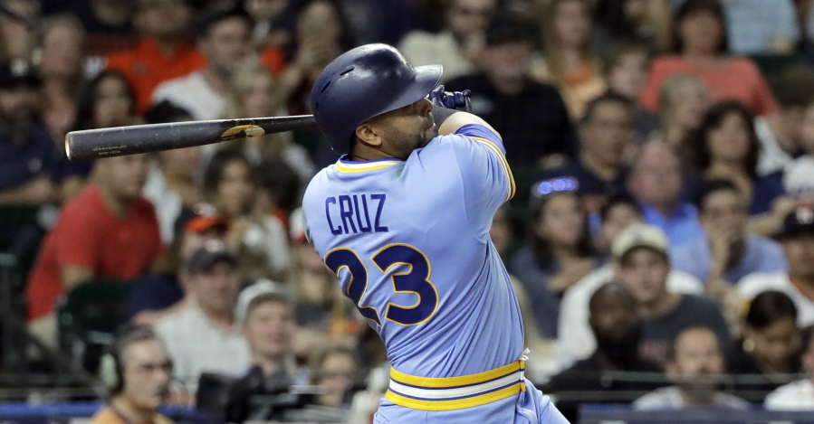 Seattle Mariners’ Nelson Cruz watches a two-run double against the Houston Astros during the eighth inning of a baseball game Friday, Aug. 10, 2018, in Houston. (AP Photo/David J.