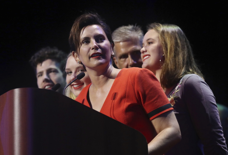 Michigan Democratic gubernatorial candidate Gretchen Whitmer stands with her family and addresses her supporters after winning the primary Tuesday in Detroit. Whitmer will face Republican Bill Schuette in November.