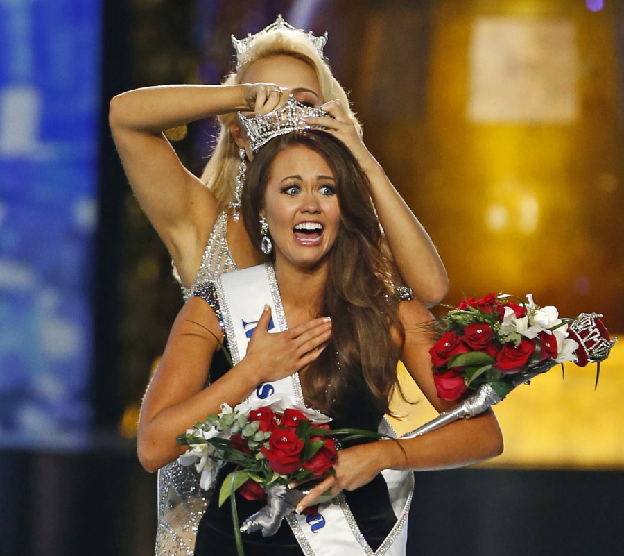 Miss North Dakota Cara Mund reacts after being named Miss America during the Miss America 2018 pageant in Atlantic City, N.J. In a letter sent to former Miss Americas on Friday, Aug. 17, 2018, Mund says she has been bullied, manipulated and silenced by the pageant’s current leadership, including chairwoman Gretchen Carlson. (AP Photo/Noah K.