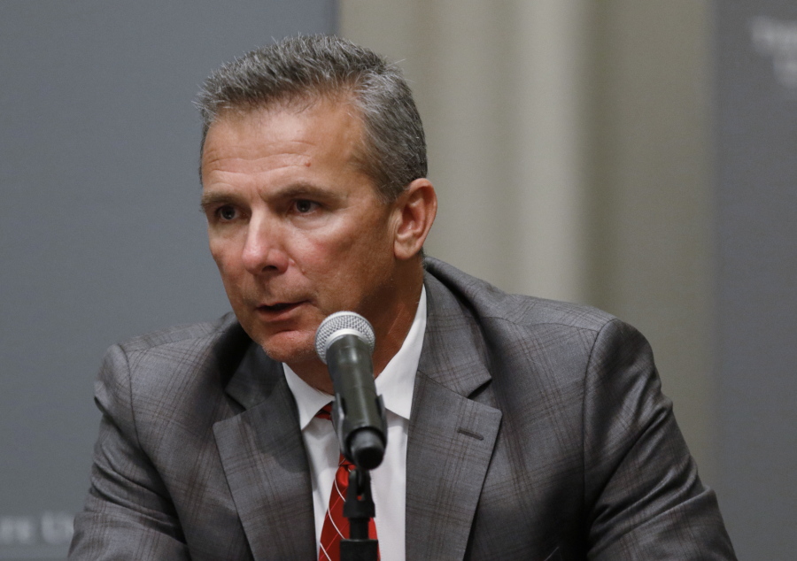 Ohio State football coach Urban Meyer makes a statement during a news conference in Columbus, Ohio, Wednesday, Aug. 22, 2018. Ohio State suspended Meyer on Wednesday for three games for mishandling domestic violence accusations, punishing one of the sport's most prominent leaders for keeping an assistant on staff for several years after the coach's wife accused him of abuse. Athletic director Gene Smith was suspended from Aug. 31 through Sept. 16.