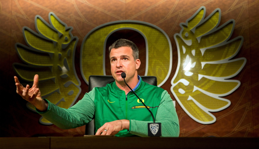 FILE - In this March 6, 2018, file photo, Oregon football head coach Mario Cristobal gestures during a news conference in Eugene, Ore.