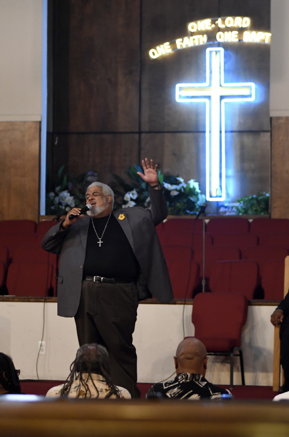 New Bethel Missionary Baptist Church Pastor Robert Smith Jr. sings at the beginning of a prayer vigil for Aretha Franklin, on Wednesday in Detroit.