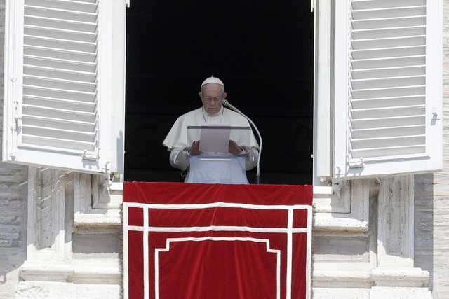 In this Sunday, Aug. 19, 2018 file photo, Pope Francis prays for the victims of the Kerala floods during the Angelus noon prayer in St.Peter's Square, at the Vatican. Pope Francis has issued a letter to Catholics around the world condemning the "crime" of priestly sexual abuse and cover-up and demanding accountability, in response to new revelations in the United States of decades of misconduct by the Catholic Church.