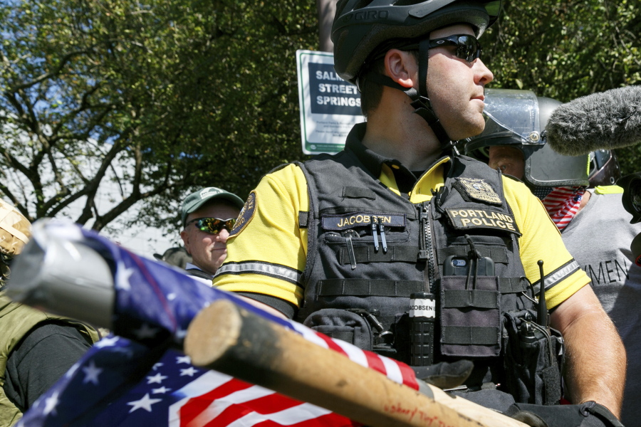 Weapons are confiscated by police before a rally in Portland on Saturday.