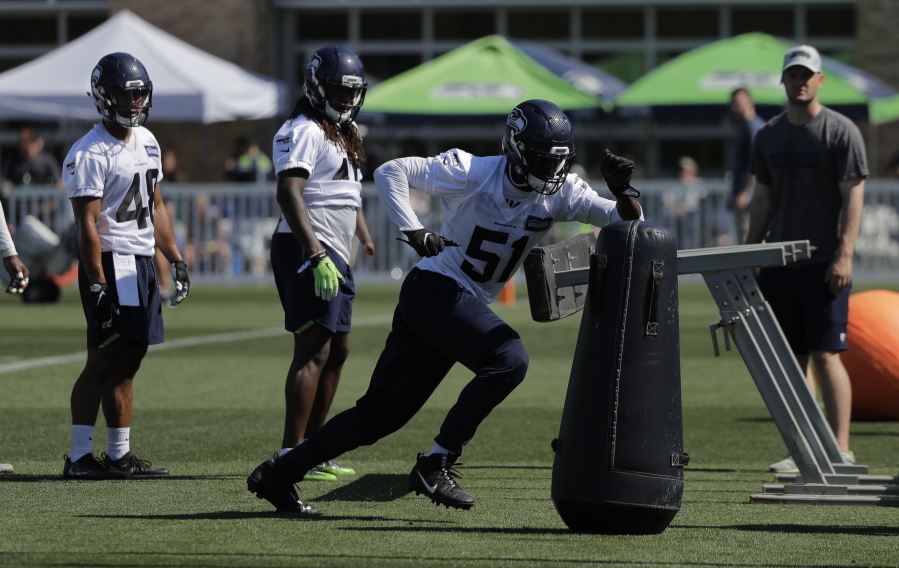 Seattle Seahawks linebacker Barkevious Mingo (51) running a drill during NFL football training camp, in Renton. (AP Photo/Ted S.
