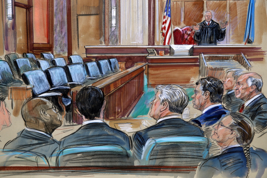 This courtroom sketch depicts U.S. District court Judge T.S. Ellis III speaking to the lawyers and defendant Paul Manafort, fourth from left, as the jury continues to deliberate in Manafort’s trial on bank fraud and tax evasion at federal court in Alexandria, Va., Friday, Aug. 17, 2018. Third from left is Manafort’s attorney Kevin Downing.