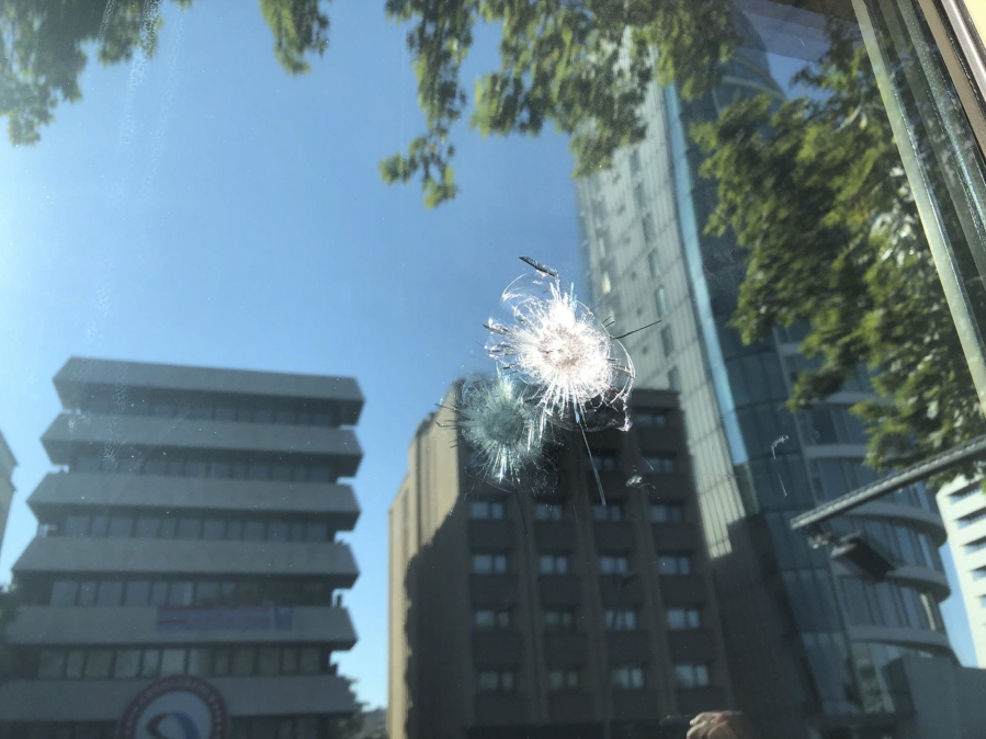 The damage to a security booth by a shot fired, is seen outside the U.S. Embassy in Ankara, Turkey, on Monday. Shots were fired at a security booth outside the embassy in Turkey’s capital early Monday, but U.S. officials said no one was hurt. Ties between Ankara and Washington have been strained over the case of an imprisoned American pastor, leading the U.S. to impose sanctions, and increased tariffs that sent the Turkish lira tumbling last week.
