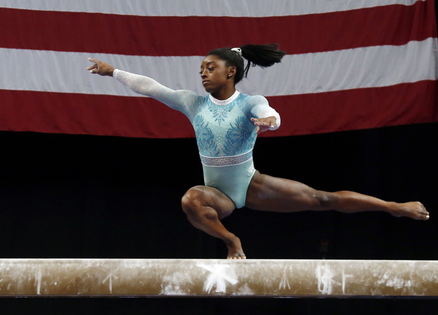 Simone Biles competes on the balance beam at the U.S. Gymnastics Championships, Sunday, Aug. 19, 2018, in Boston.