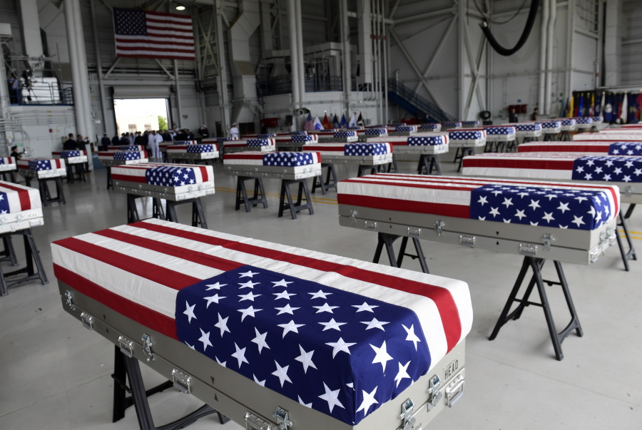 Transfer cases containing remains believed to be U.S. service members sit in a hangar Wednesday at Joint Base Pearl Harbor-Hickam in Hawaii. North Korea handed over the remains last week.