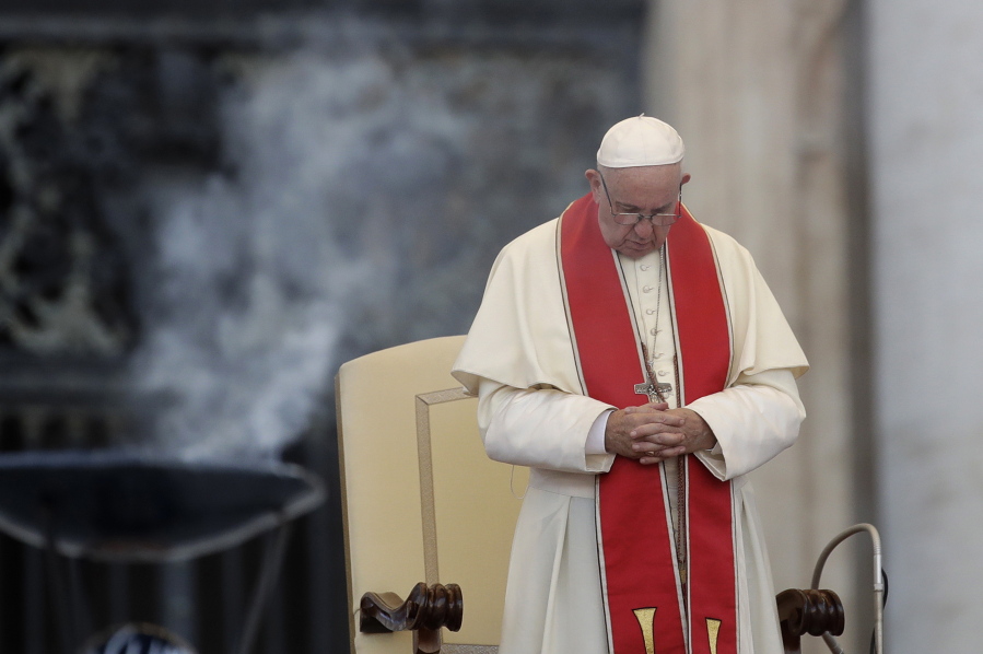Pope Francis prays during an audience in St. Peter’s square at the Vatican. The Vatican said Thursday Aug. 2, 2018, that Pope Francis has changed church teaching about the death penalty, saying it can never be sanctioned because it “attacks” the inherent dignity of all humans.
