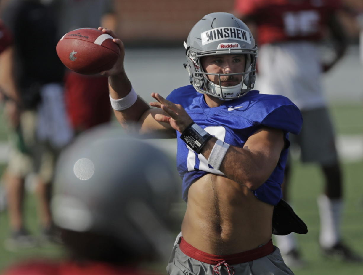 Washington State quarterback Gardner Minshew passes during NCAA college football practice, Thursday, Aug. 16, 2018, in Pullman, Wash. Minshew is one of three quarterbacks competing for the starting job. (AP Photo/Ted S.