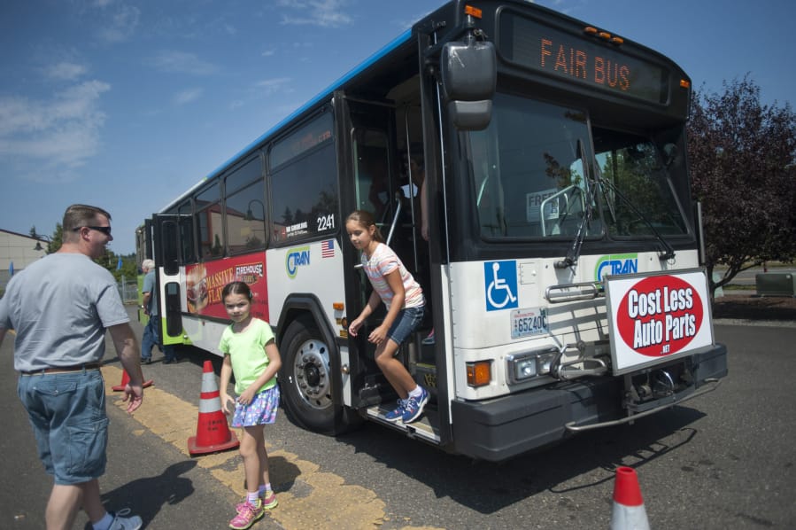 A C-tran bus drops off passengers at the Clark County Fairgrounds in Ridgefield Wednesday August 12, 2015.