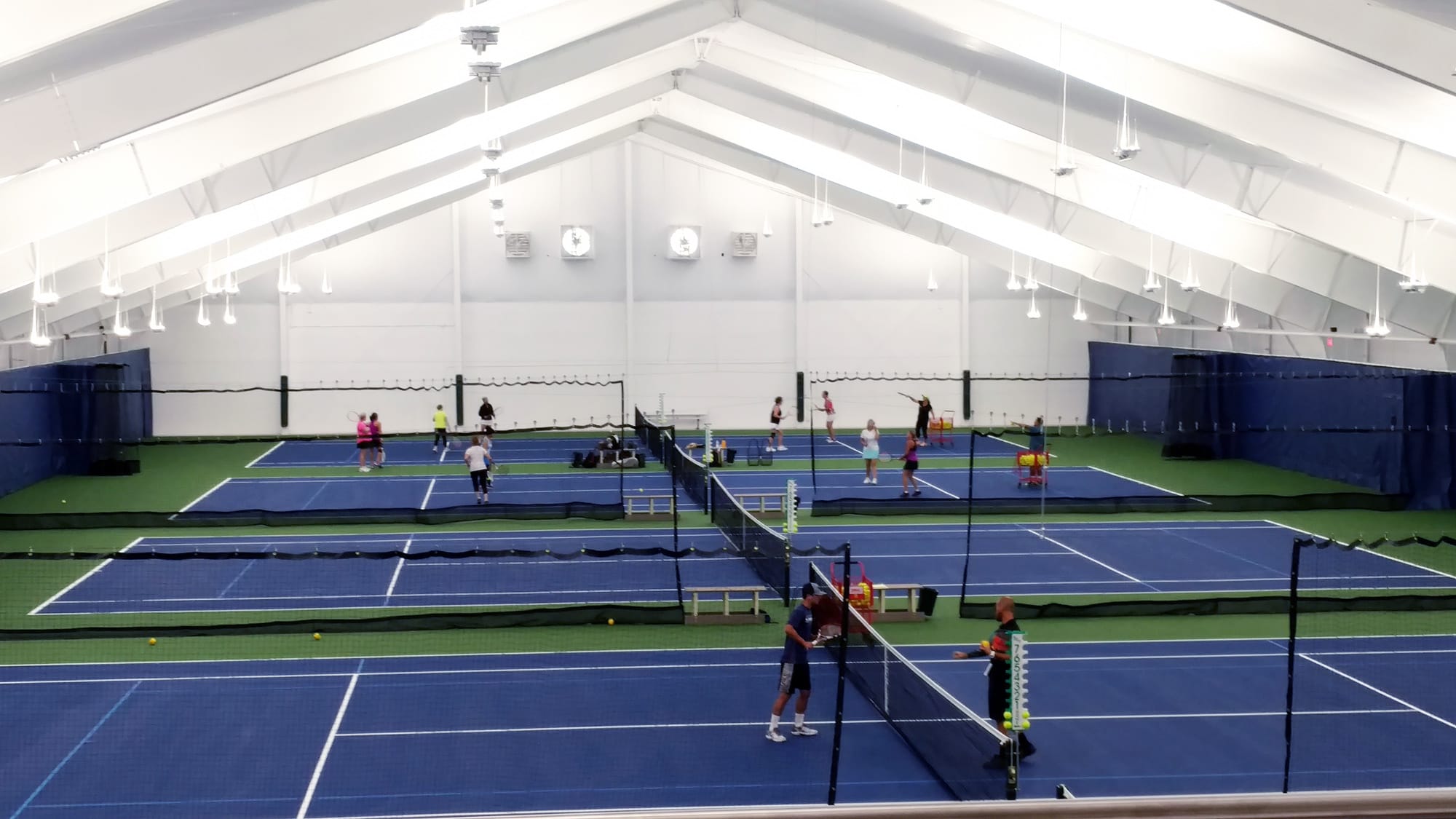 Tennis players enjoy the first hits on the renovated Vancouver Tennis Center courts after the facility's reopening on Sept. 3, 2018.