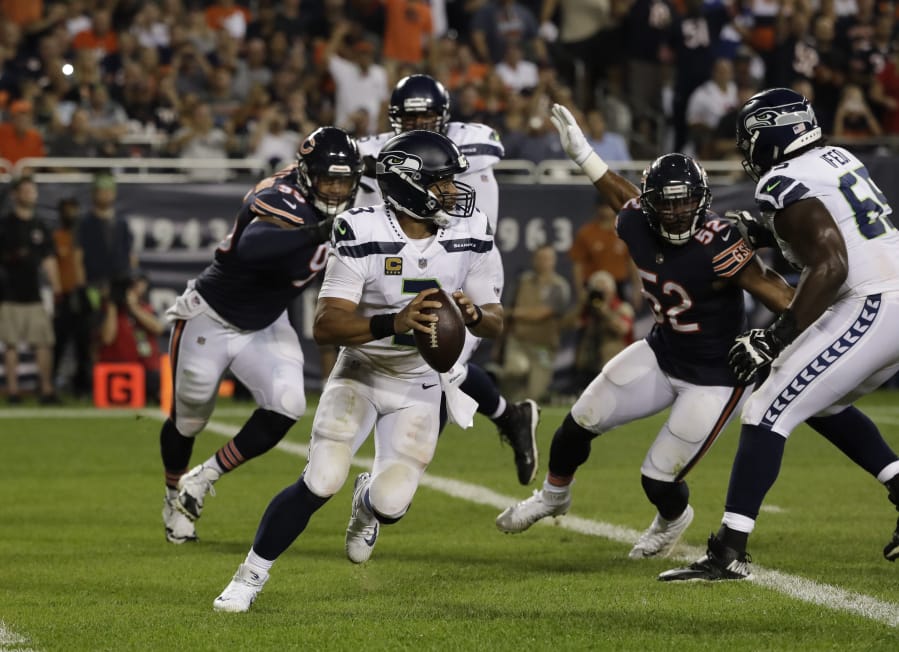 Seattle Seahawks quarterback Russell Wilson (3) looks to throw against the Chicago Bears during the second half of an NFL football game Monday, Sept. 17, 2018, in Chicago. (AP Photo/Nam Y.