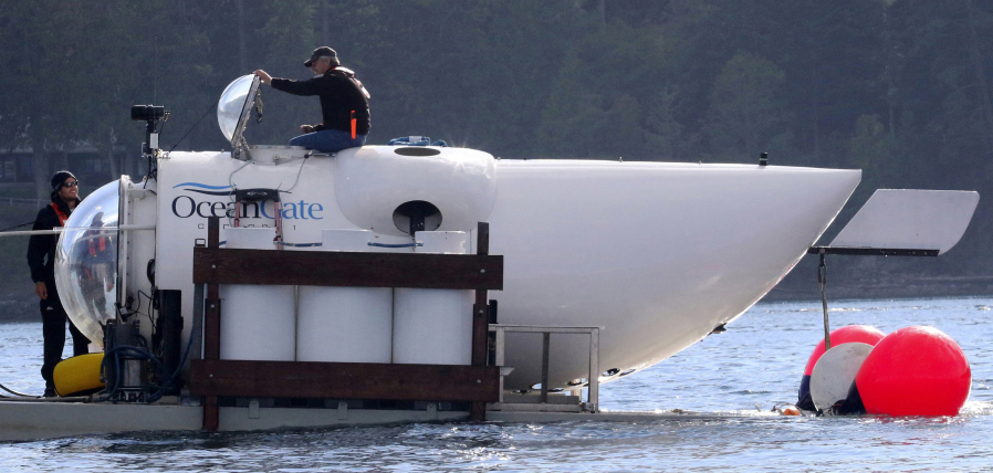 Pilot Stockton Rush emerges from the hatch atop the OceanGate submarine in the San Juan Islands off Point Caution. Rush is also CEO of Everett-based OceanGate. On this research mission, the vessel, which holds five, dove to 360 feet below the surface.