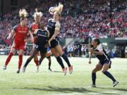 Portland Thorns' Crystal Dunn (19) heads the ball away during a National Women's Soccer League Championship Game held at Providence Park in Portland, Ore. on Saturday, Sept. 22, 2018.