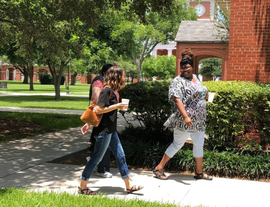 Milly Horsley, left in black shirt, and Gracie Robinson, right, walk to class at New Orleans Baptist Theological Seminary.
