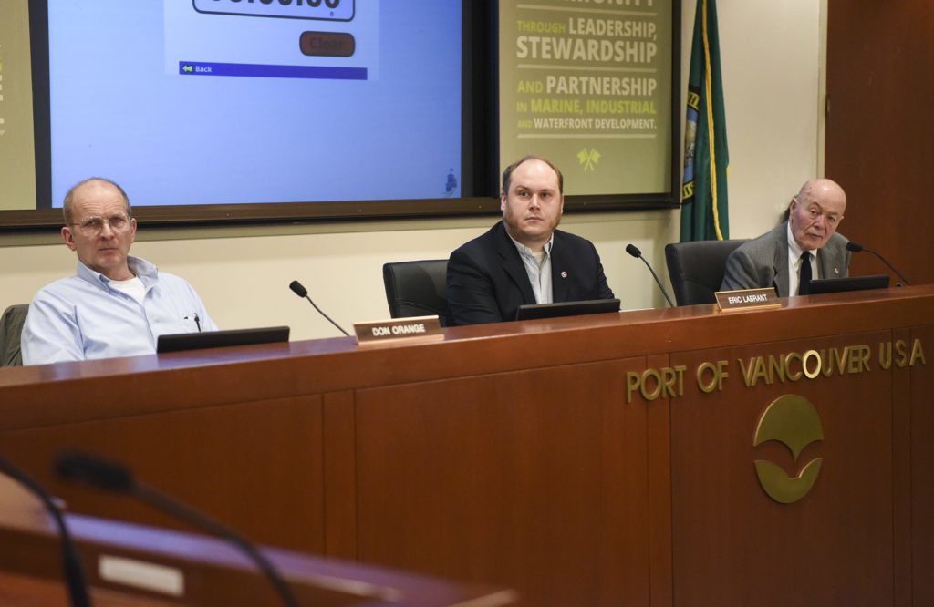 Port of Vancouver’s board of commissioners from left, Don Orange, Eric LaBrant and Jerry Oliver, listen to public statements during a board meeting in January.