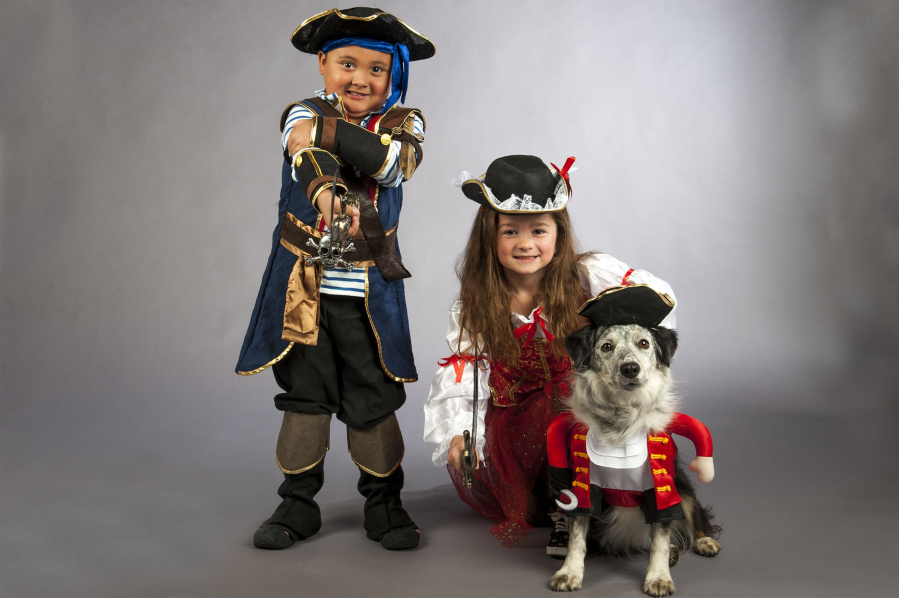 Kennedy Cannine, 5, left, Sierra Fronckowiak, 6, and Willow the dog are ready to party like pirates in Washougal on Sept. 15. Pirates in the Plaza is a fundraiser for the West Columbia Gorge Humane Society and the Downtown Washougal Association.