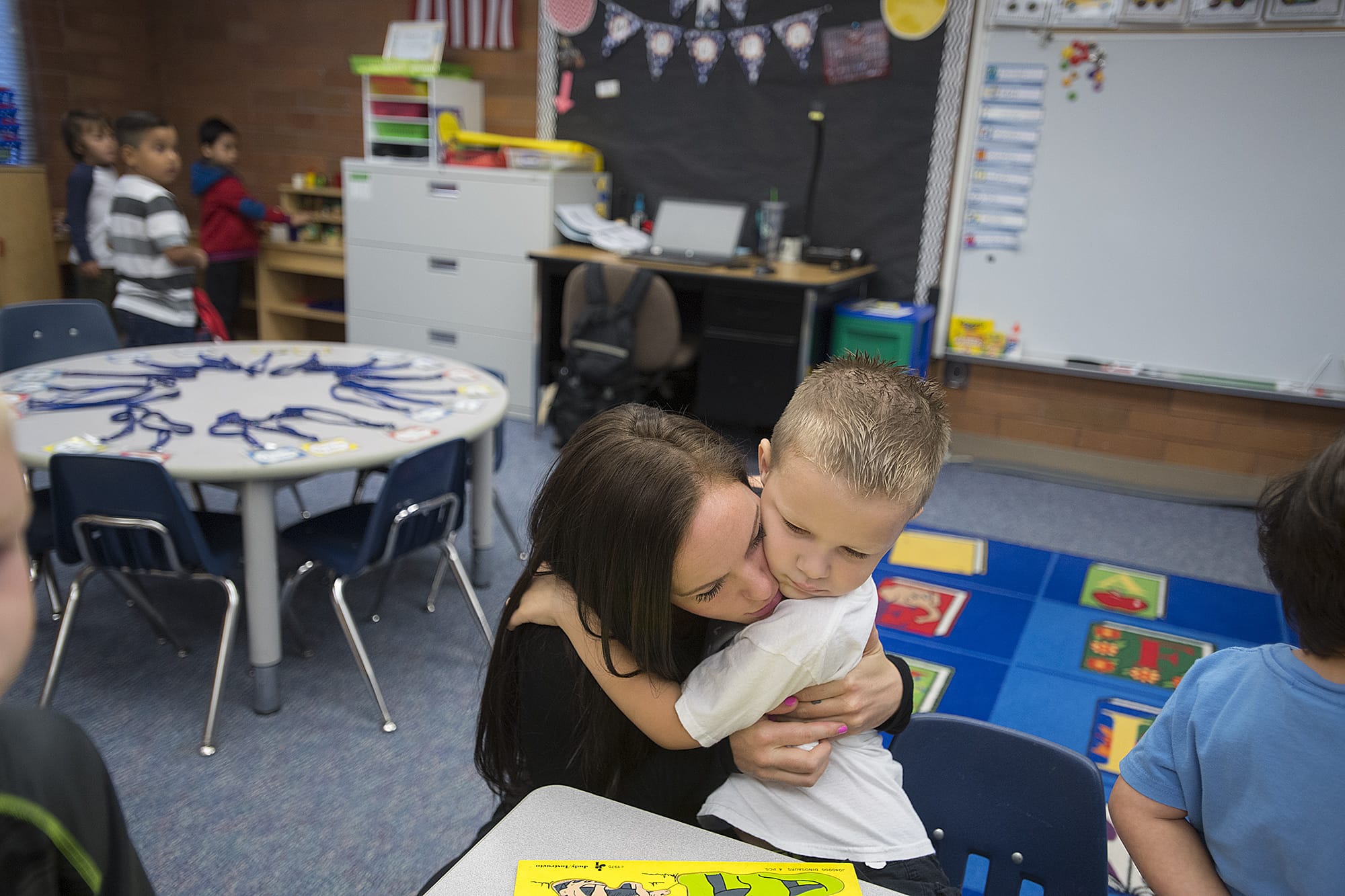 Katie Akerill shares a goodbye hug with her son, Wade, 5, during his first day of kindergarten at Ogden Elementary School on Wednesday morning, Sept. 5, 2018.