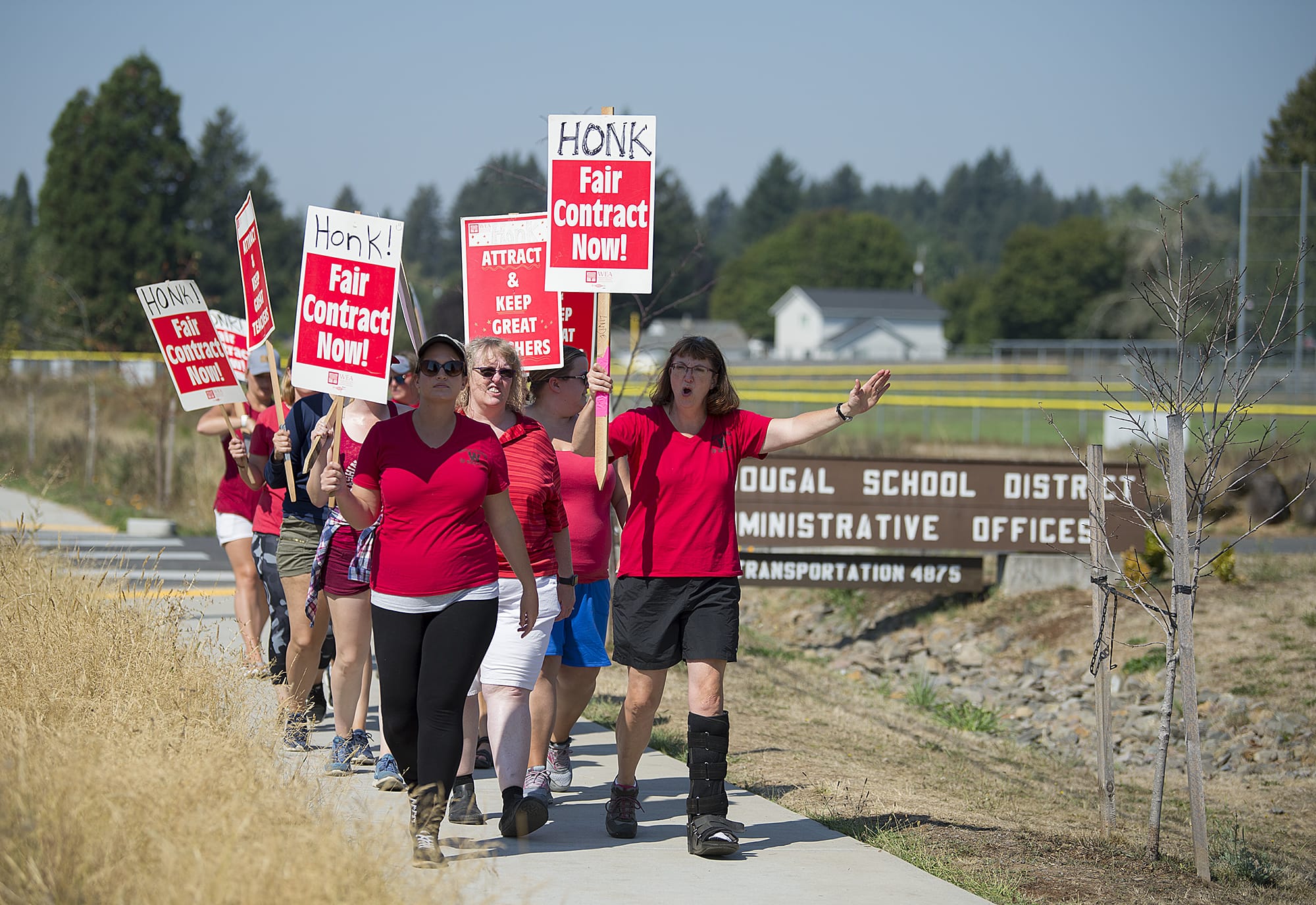 Members of the Washougal Association of Teachers join supporters in marching outside the Washougal School District Administrative Offices on Wednesday afternoon. Shortly after 6 p.m., the Washougal School District announced it had reached a tentative agreement with the teachers union to end a strike that started Aug. 28.
