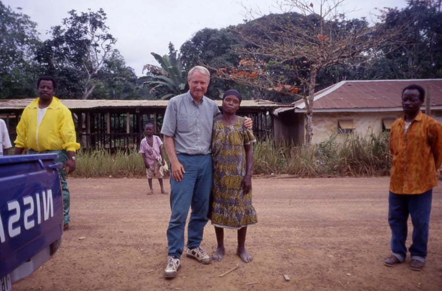 WSU Vancouver anthropology professor Barry Hewlett, left, poses with an Ebola survivor in the Republic of Congo.