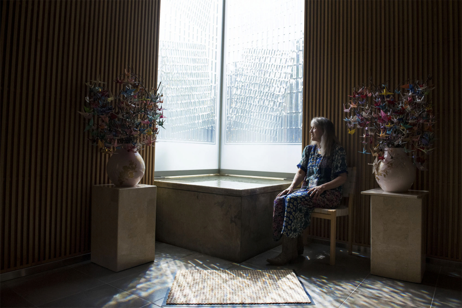 Gwendolyn Morgan, the incoming poet laureate of Clark County and the spiritual care manager at Legacy Salmon Creek Medical Center, enjoys the light that pours through textured glass into the hospital’s rooftop chapel.