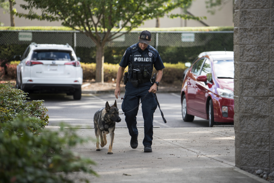 Officer Rocky Epperson and his canine Koa are pictured outside the Vancouver Police Department West Precinct. Koa completed K-9 training earlier this month.