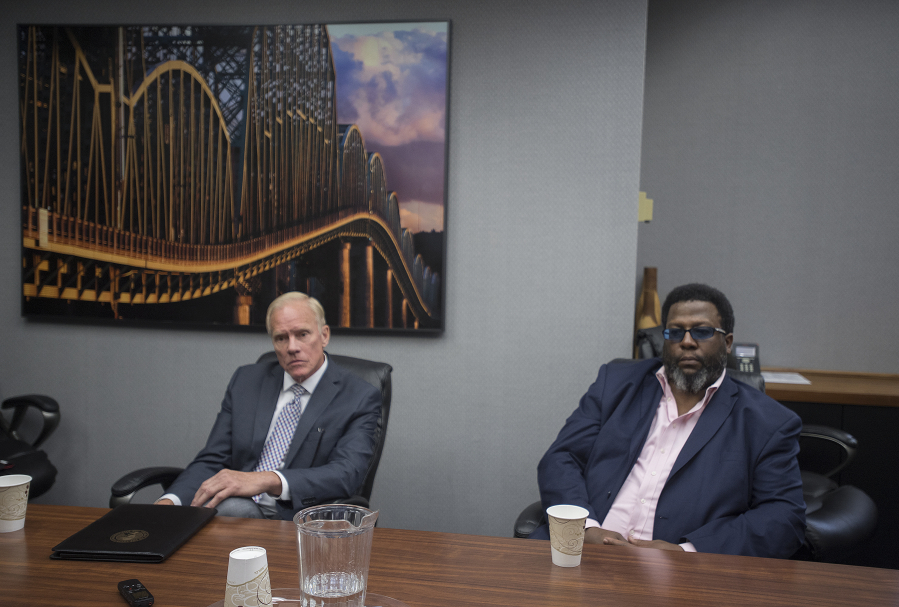 Legislative candidates Paul Harris, left, and Damion Jiles talk with members of The Columbian’s Editorial Board about the 17th Legislative District race Wednesday.
