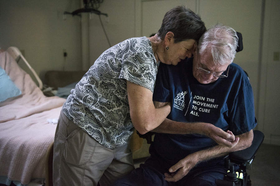 Carol Gabriel helps her husband, Lyndon Gabriel, get situated in his motorized chair after an afternoon nap at their home in Vancouver. He was diagnosed with ALS about three years ago. “I’ve had a good life,” Lyndon said.