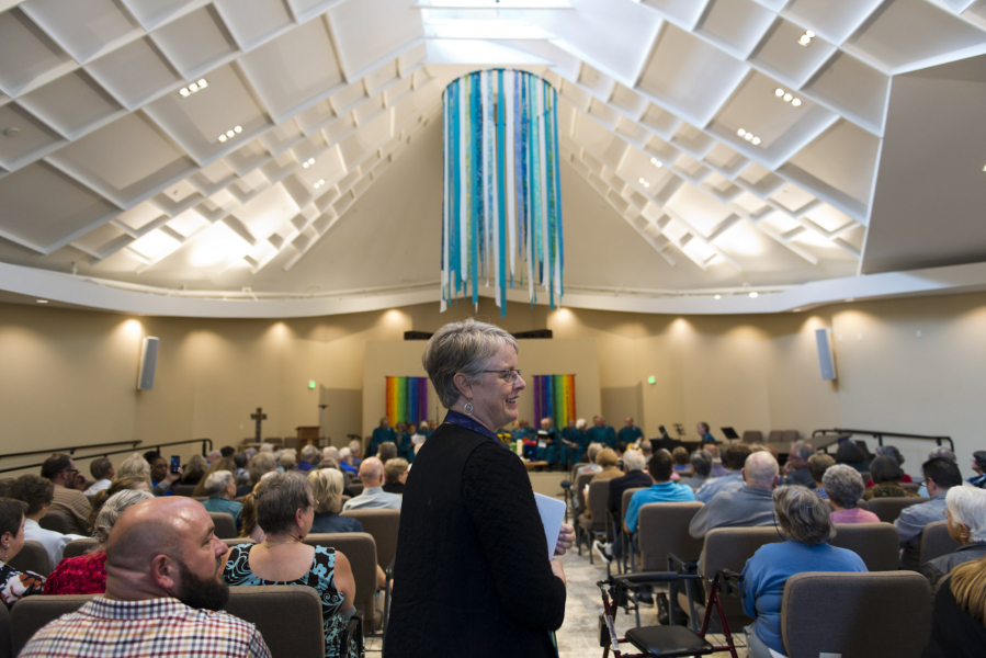 Vancouver United Church of Christ Pastor Jennifer Brownell starts proceedings during a rededication ceremony for the church Sunday, after it suffered heavy damage from an arson fire in May 2016.