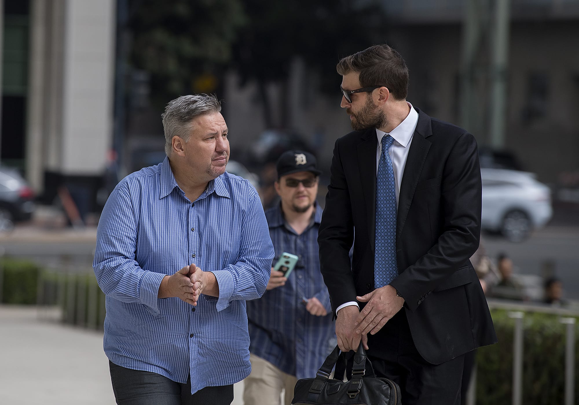 Former Vancouver pastor John Bishop, left, arrives to be sentenced for unlawful importation of a controlled substance-marijuana at the James M. Carter and Judith N. Keep United States Courthouse in San Diego, Calif., on Friday morning, Sept. 21, 2018.
