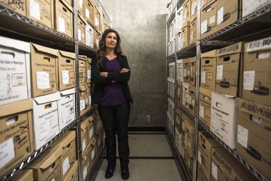 Lindsay Schultz, one of three major crimes detectives in the Clark County Sheriff’s Office, stands in the archive room of the sheriff’s office.