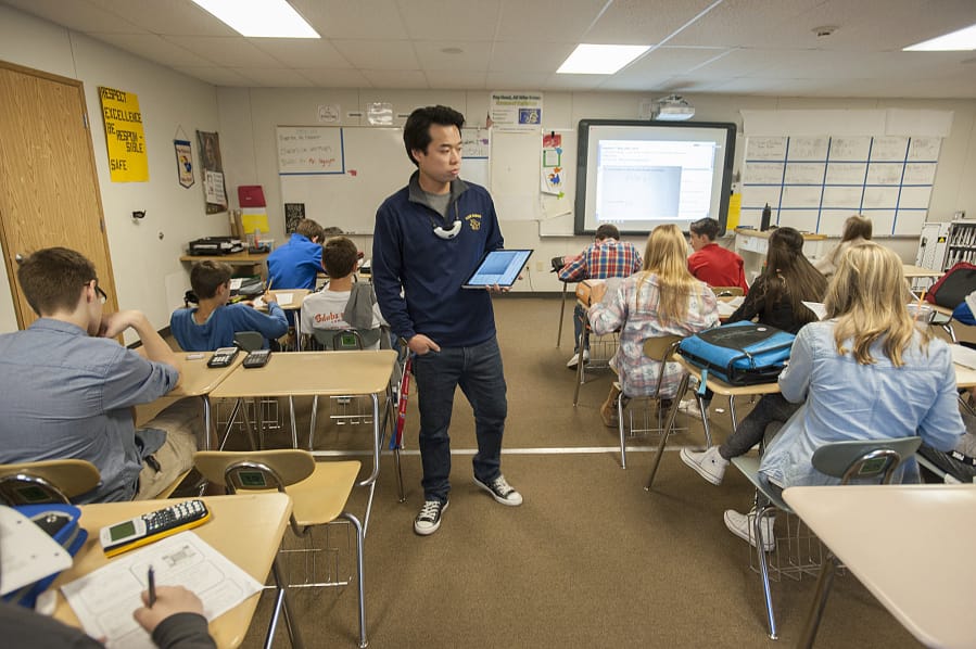 View Ridge Middle School math teacher Nam Nguyen works with eighth-grade students at View Ridge Middle School.