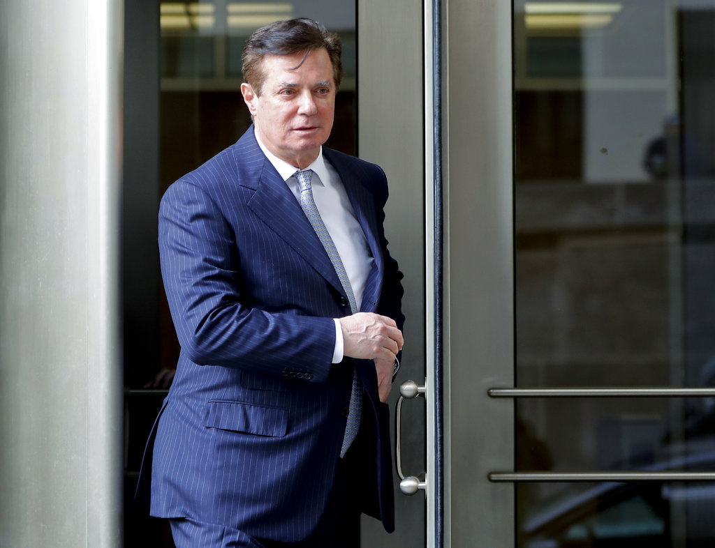 FILE - In this Feb. 14, 2018 file photo, Paul Manafort, President Donald Trump's former campaign chairman, leaves the federal courthouse in Washington.
