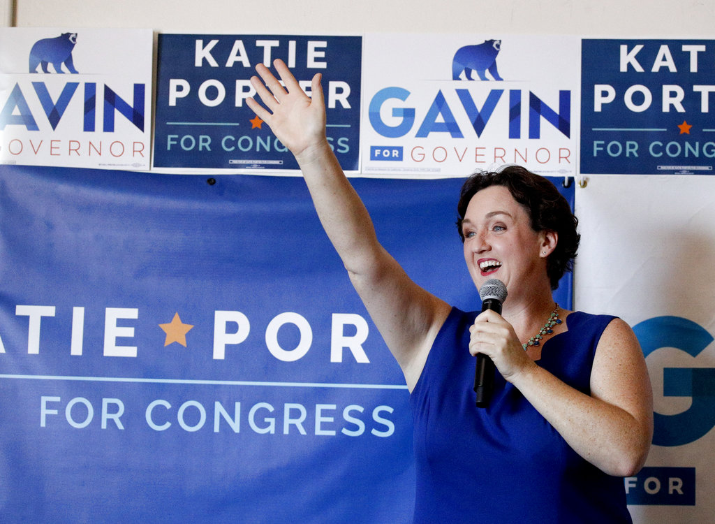 In this Saturday, Sept. 15, 2018, photo, Katie Porter, candidate seeking election to the U.S. House to represent the 45th Congressional District of California arrives for a campaign event in Tustin, Calif. California Rep. Mimi Walters continued support of the tax overhaul sets up a stark choice in a district won by Democrat Hillary Clinton in the 2016 presidential race. Walters’ opponent, Porter, is trying to make the tax changes a key part of her argument against the incumbent.