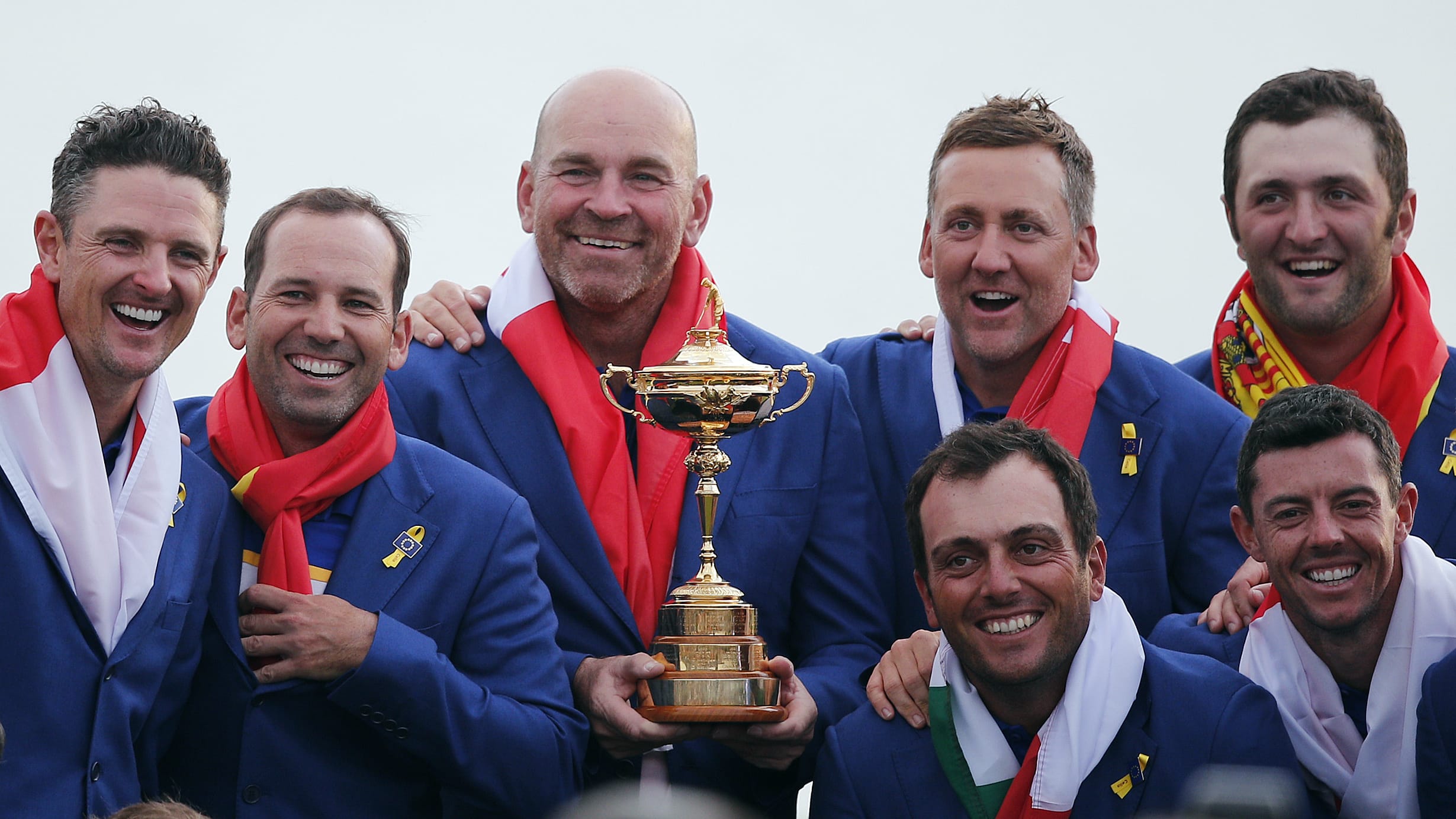 Europe team captain Thomas Bjorn, center, holds the trophy as he celebrates with his team after Europe won the Ryder Cup on the final day of the 42nd Ryder Cup at Le Golf National in Saint-Quentin-en-Yvelines, outside Paris, France, Sunday, Sept. 30, 2018.
