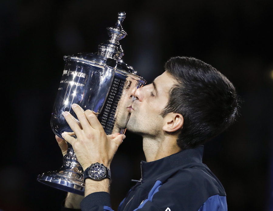 Novak Djokovic, of Serbia, kisses the trophy after defeating Juan Martin del Potro, of Argentina, in the men’s final of the U.S. Open tennis tournament, Sunday, Sept. 9, 2018, in New York.
