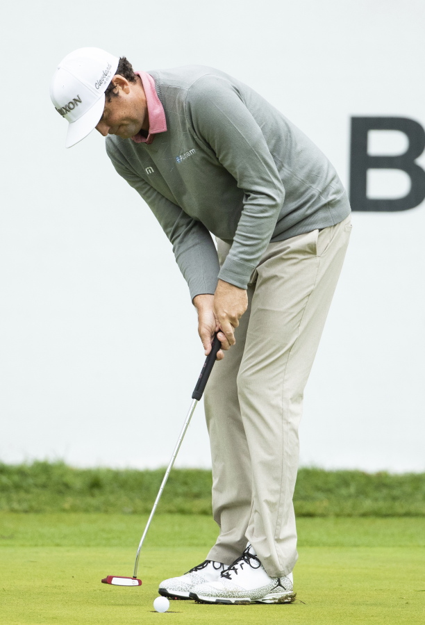 Keegan Bradley putts for the win in the playoff hole during the BMW Championship golf tournament at the Aronimink Golf Club, Monday, Sept. 10, 2018, in Newtown Square, Pa. Bradley held off Justin Rose in a sudden-death playoff to win the rain-plagued BMW Championship for his first PGA Tour victory in six years.
