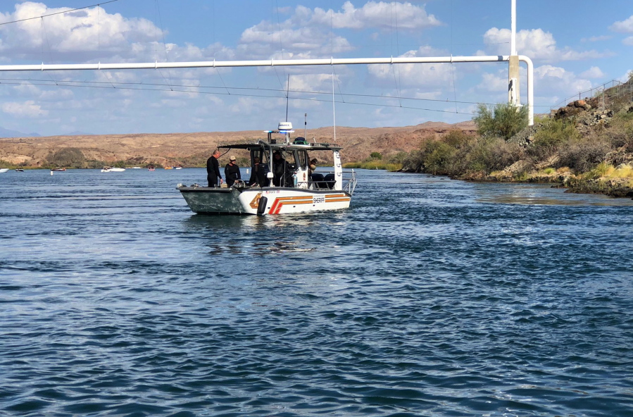 In this photo released by the San Bernardino County, Calif., Sheriff’s Office, shows search and recovery operations Monday, Sept. 3, 2018, for three people missing after two boats collided Saturday evening on the Colorado River along the California-Arizona border near Topock, Ariz. The body of a California woman was found Monday, authorities said. A search continued for two other women and one man.