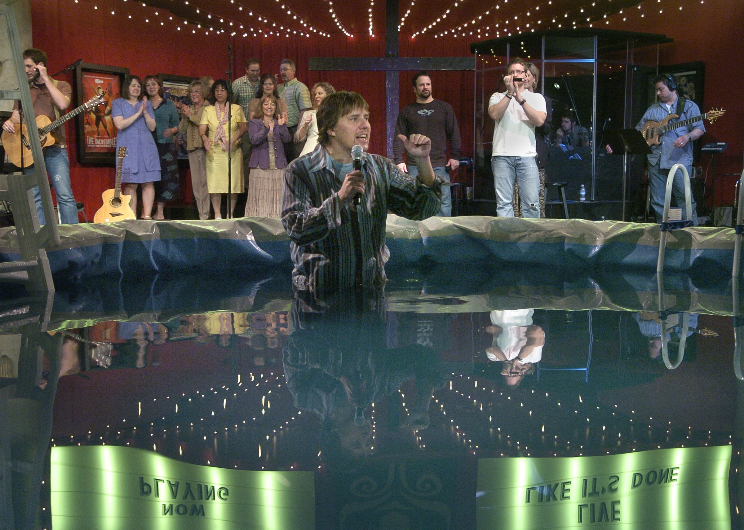 John Bishop, former pastor of the Living Hope Church, performs baptisms during Easter services in 2006.