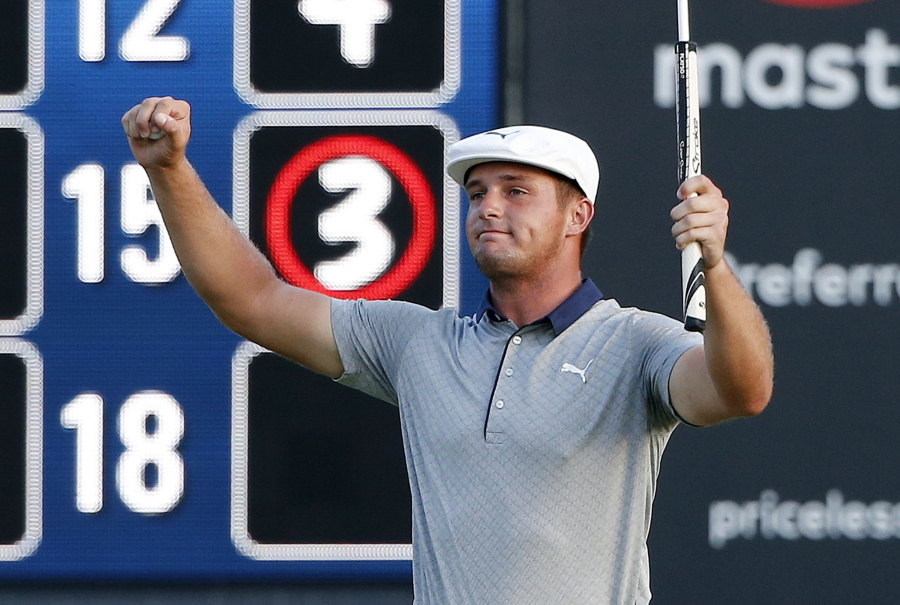 Bryson DeChambeau reacts after putting out on the 18th hole during the final round of the Dell Technologies Championship golf tournament at TPC Boston in Norton, Mass., Monday, Sept. 3, 2018.