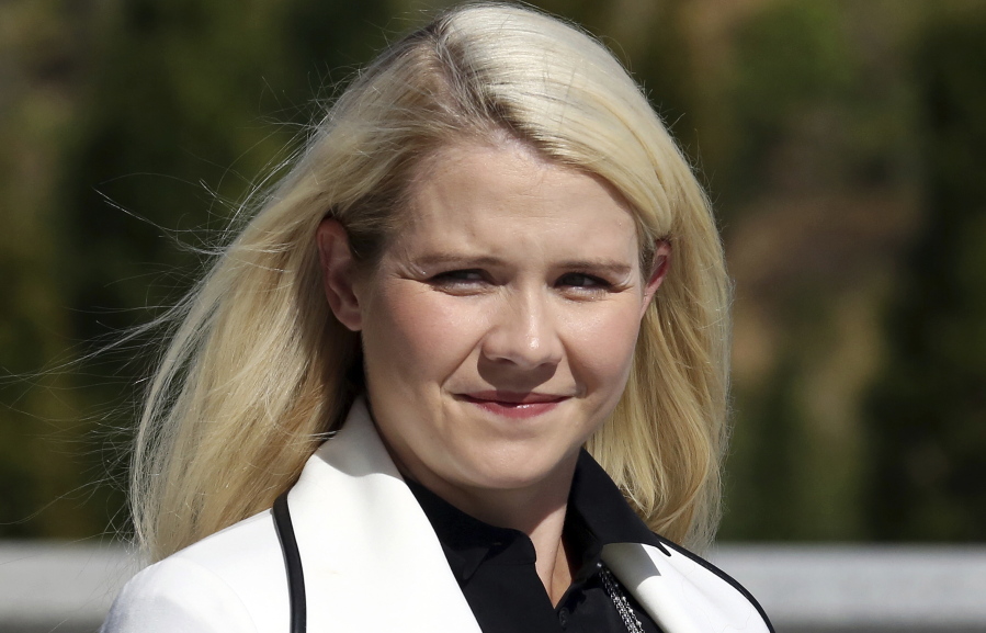 Elizabeth Smart arrives for a news conference in Salt Lake City. Smart says she’s been “reassured” the woman who helped kidnap her when she was 14 and stood by as she was sexually assaulted will be watched when she’s released from prison. Appearing in an interview Tuesday, Sept. 18, on “CBS This Morning,” Smart said she believes Wanda Barzee remains a danger.