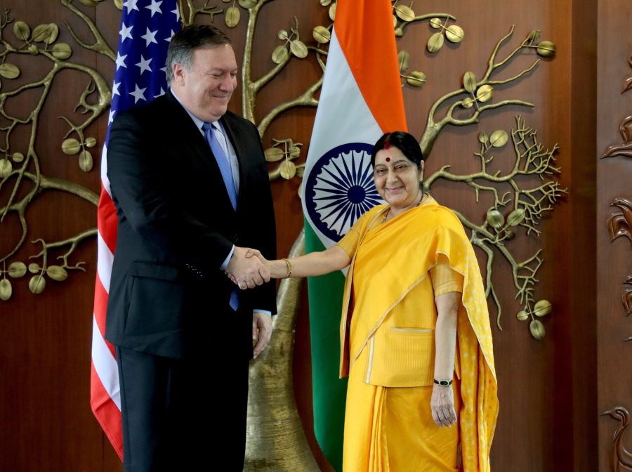 U.S. Secretary of State Mike Pompeo, left, shakes hand with Indian Foreign Minister Sushma Swaraj before a meeting in New Delhi, India, on Thursday. Pompeo and Defense Secretary James Mattis are holding long-delayed talks Thursday with top Indian officials, looking to shore up the alliance with one of Washington’s top regional allies.